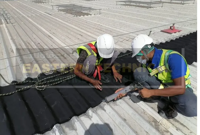 ETCE team installing EPDM waterproofing on a metal roof in Dammam KSA
